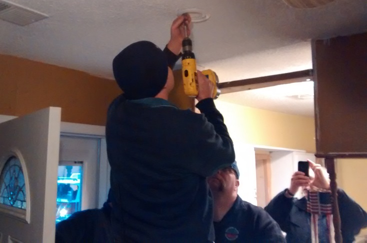 Working together with SPFPD to install smoke detectors in home