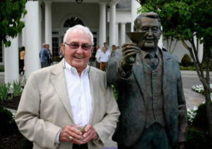 Bill Grigsby with his statue at The National