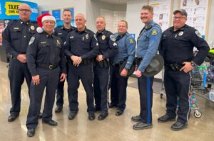 Group photo from 2024 Shop with a Cop event